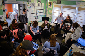 Justin Mattingly (left) and Alexa Díaz (right) sit with D.O. staff members in fall 2016.