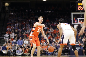 Our beat writers predict Syracuse's two-game win streak will come to an end on Monday against No. 8 Virginia. 