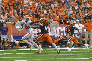 Clemson wide receiver Tee Higgins received a facemask penalty for this stiff arm on a Syracuse defender in the first quarter. 