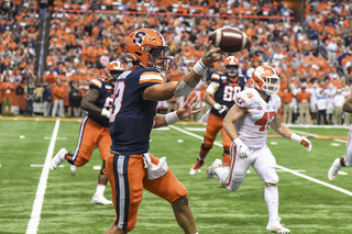 DeVito tries to make a throw on the run as he consistently faced pressure from Clemson's front seven. 
