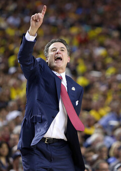 Rick Pitino signals out to his team.