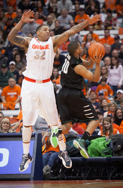 DaJuan Coleman (left) attempts to block Yosef Yacob's shot. 