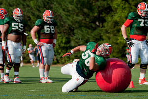 John Miller participates in offensive line drills during Syracuse's training camp, which concluded last week. The Orange's season opener against Penn State is on Saturday afternoon at MetLife Stadium. 