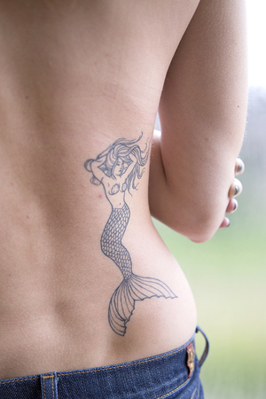 Rachel Moore's most recent Tattoo, a mermaid, has a nautical theme that she plans to continue.