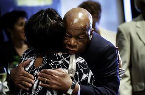 John Lewis, a U.S. representative from Georgia, embraces Margarette B. Nelson in Atlanta at a conference where families of victims lost to Civil Rights era murders converged. The conference, held in 2010, was the first time the families met in one place.