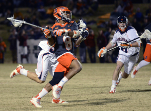 Hakeem Lecky winds up for a shot in Syracuse's 17-12 loss to Virginia on Saturday. Lecky led an electric midfield with four goals.