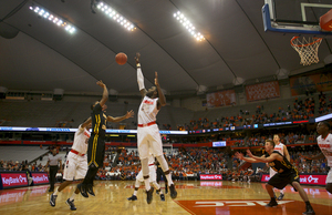 Rakeem Christmas rises up to block a shot by an Adrian player during Syracuse's 85-35 whooping of the Bulldogs in the Carrier Dome on Monday night. 