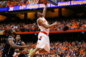 Ron Patterson goes in for a reverse layup. He scored nine points on 4-of-5 shooting, and was a spark on a day when SU was looking for one. 