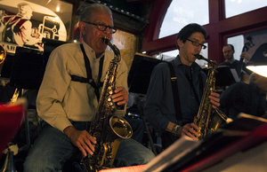 Joe Riposo, an 82-year-old jazz musician, has a wide range of talents. Here he is playing the saxophone.