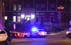 Police tape off an area near Walnut Park after shots were exchanged between a police officer and an SU employee during a traffic stop. It was one of several major Syracuse news stories to develop in 2016.