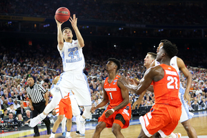 The Orange lost, 83-66, to the Tar Heels in the Final Four in Houston on April 2, 2016. UNC scored 50 points in the paint, including this Justin Jackson floater. 