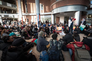 Dina Eldawy, Syracuse University Muslim Student Association President, uses a megaphone to speak during a protest on the campus of Syracuse University. The protest was in retaliation of President Trumps ban on refugees that was recently passed.