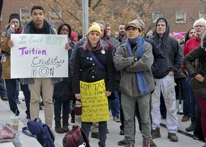 Syracuse Graduate Employees United members previously protested the GOP's tax cuts and jobs act outside Hendrick's Chapel in November, pictured above.