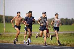 Philo Germano, pictured during cross country season on the far right, won the mile at the ECAC/IC4A Indoor Championships on Sunday.