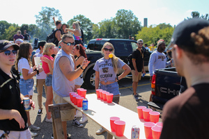 Western Michigan fans play a drinking game prior to the Broncos’ matchup against Syracuse.