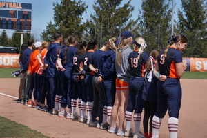 Syracuse lines up before a game for the national anthem.