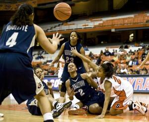 Erica Morrow scrambles for the ball against four Georgetown players Sunday at the Carrier Dome. Syracuse lost to the Hoyas for the second time this season, 73-72. 