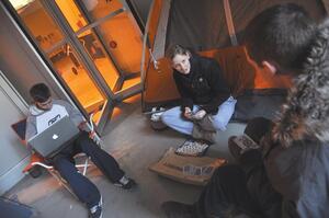 (From left) Trevor Hass, Brooke Gordon and Josh Hamblin, members of Ottos Army, camp outside the Carrier Dome in hopes of getting front-row seats at the upcoming game.