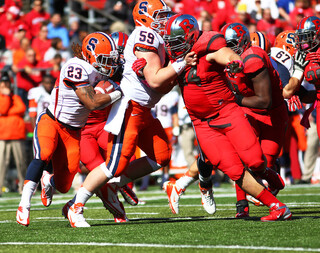 Prince-Tyson Gulley looks for some running room around center Macky MacPherson.