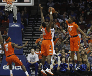 James Southerland leaps to make a block from behind. The SU forward shot 4-of-12 from the field, 3-of-9 from beyond the arc in an 11-point performance.