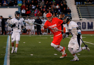 Peter Macartney defends Villanova's Max Hart.