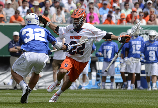 JoJo Marasco dodges inside Blue Devils defender Greg DeLuca. Marasco scored two late goals as SU's comeback fell well short.