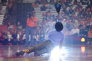 Hilby the Skinny German Juggle Boy performs before the basketball teams scrimmage.