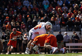 Syracuse's Chris Daddio scraps for a faceoff. The SU senior won 15-of-26.