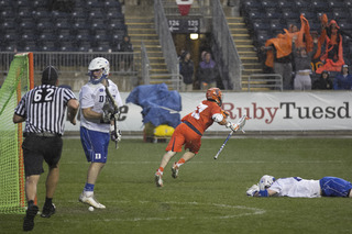 Dylan Donahue runs in excitement after his last-seond goal that completed Syracuse's late comeback.