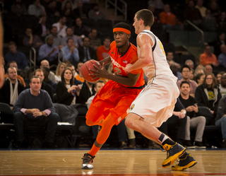 Johnson drives right against a Golden Bears' defender. The sophomore finished with seven rebounds, but no points and no assists.