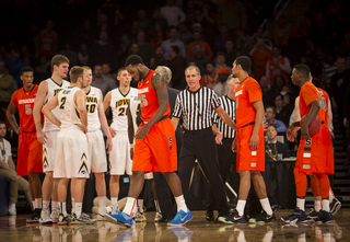 Christmas walks off the court with his head down during SU's 66-63 victory.