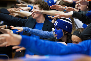 Lauren Anders, a freshman, holds an arm out before the Blue Devils took on the Orange on Saturday night.