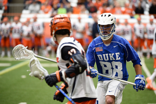 Donahue waits to dodge against DU defender Brian Dunne.