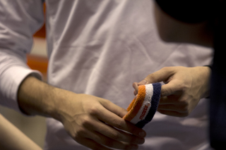 Pregler plays nervously with his Syracuse University head band before his second half performance. He wears the headband for every appearance as Otto the Orange. 