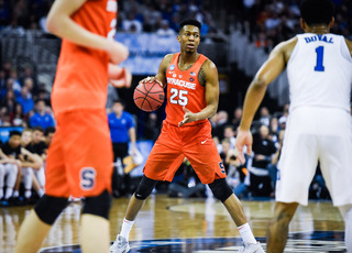 Battle dribbles near center court, looking to create against the Blue Devils 2-3 zone. 