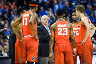 Syracuse huddles during a timeout. Boeheim said last week that he offers fewer pointers during stoppages and lets his players rest.