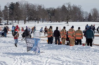 Volunteer firefighters from the Syracuse area gather at the tournament in support of the players. 