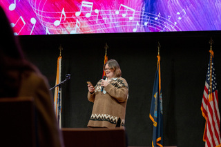 Remembrance Scholar Riley Moore reads a piece entitled “After The Storm.” Moore’s piece is an original work that she decided to share with the crowd. 