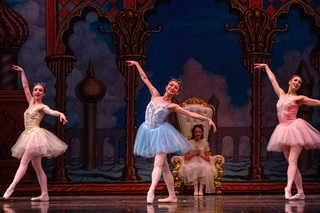 Clara watches the three macarons perform their dance for her in the Land of Sweets. Cara Connolly, Azusa Okamoto, and Abigail Stewart sashayed across the stage dressed in pastel-colored sparkly tutus. 